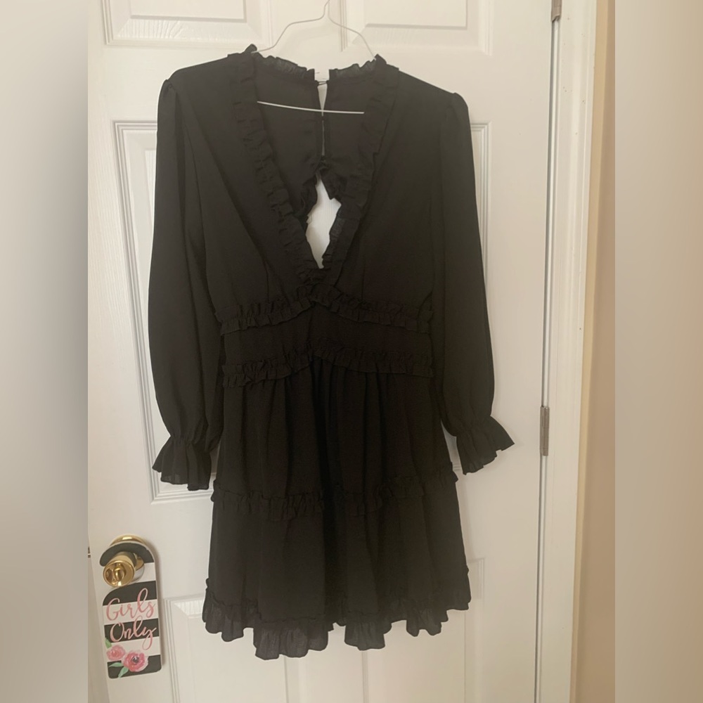 Long sleeve ruffle black v-neck dress with a button up back